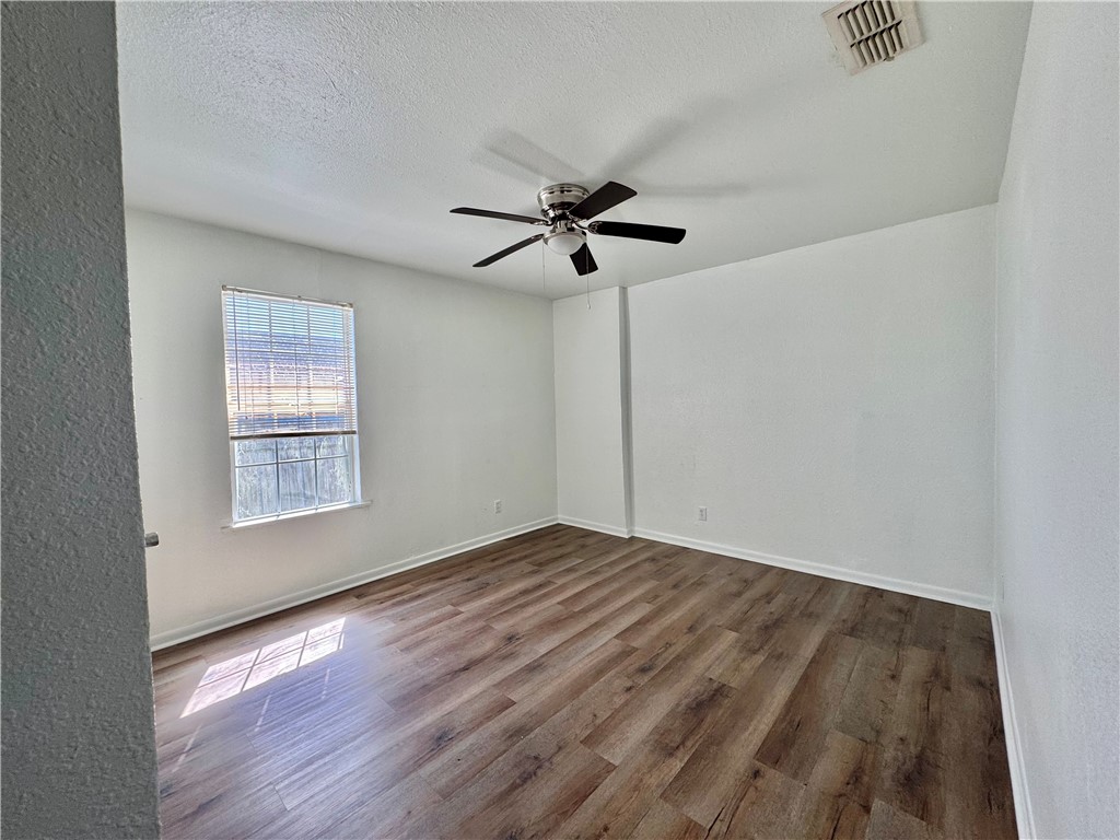 710 East C Avenue Kingsville, TX 78363 - Photo 9 of 13 a view of an empty room with a window