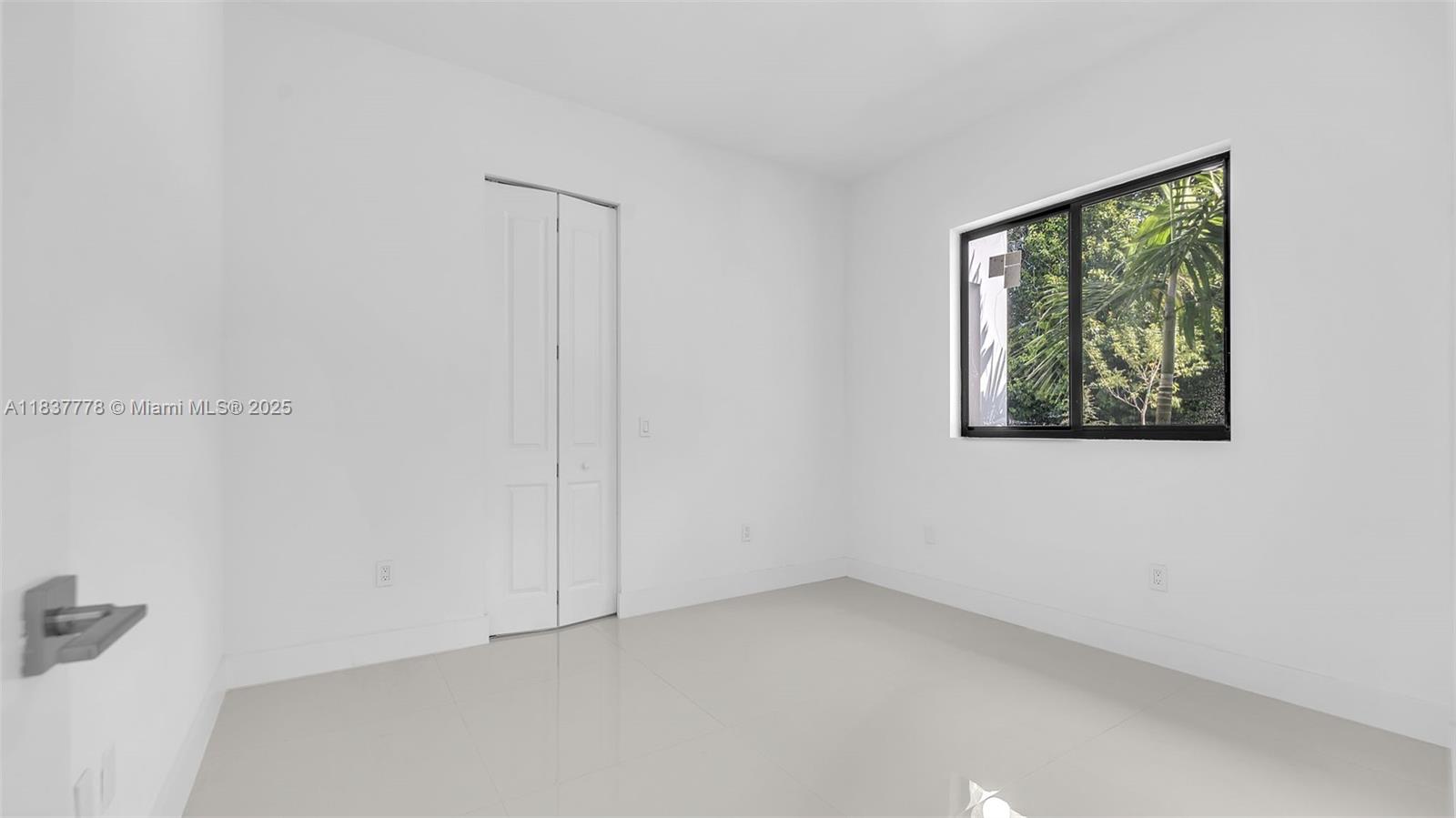 23120 Southwest 154th Court Miami, FL 33170 - Photo 16 of 51 a view of an empty room with a window