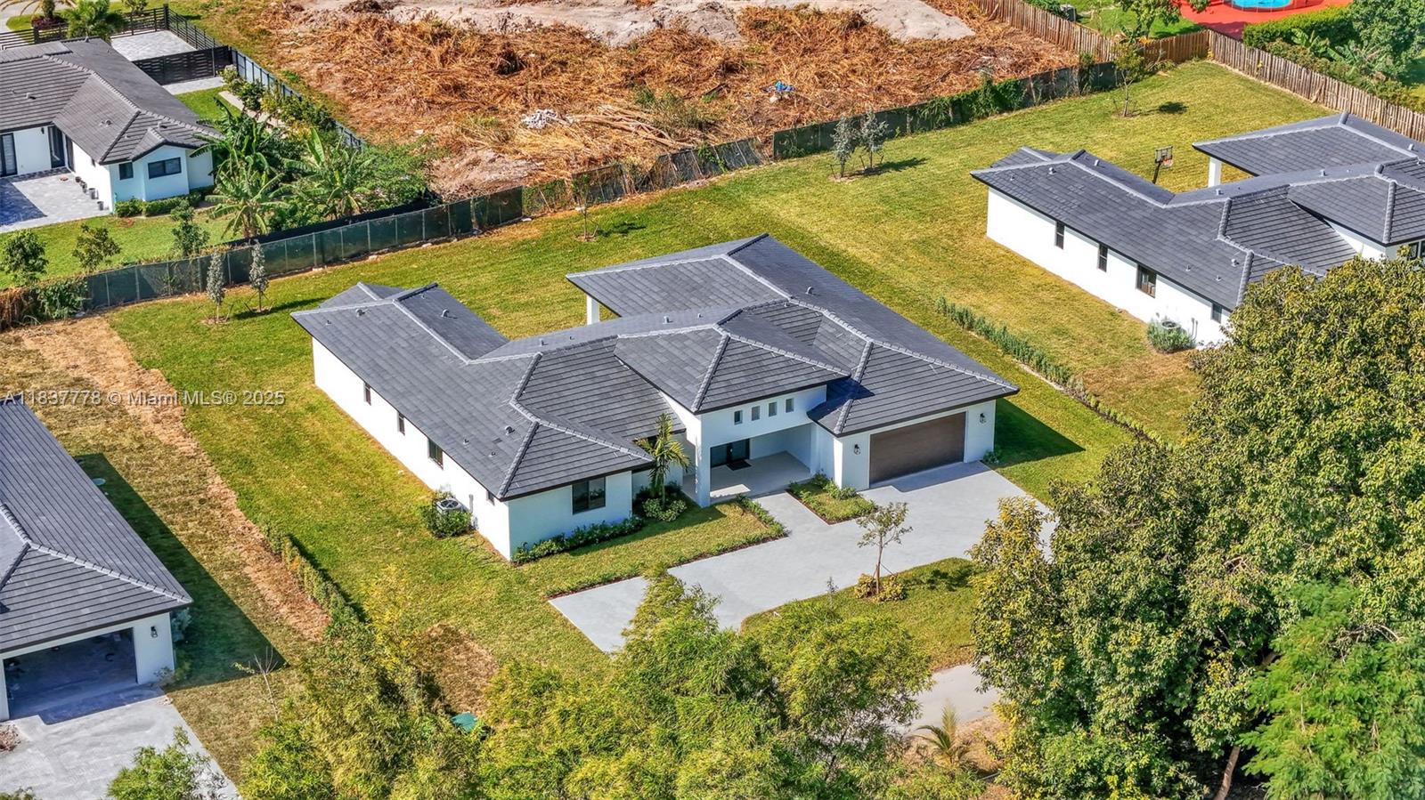23120 Southwest 154th Court Miami, FL 33170 - Photo 2 of 51 an aerial view of a house with a big yard