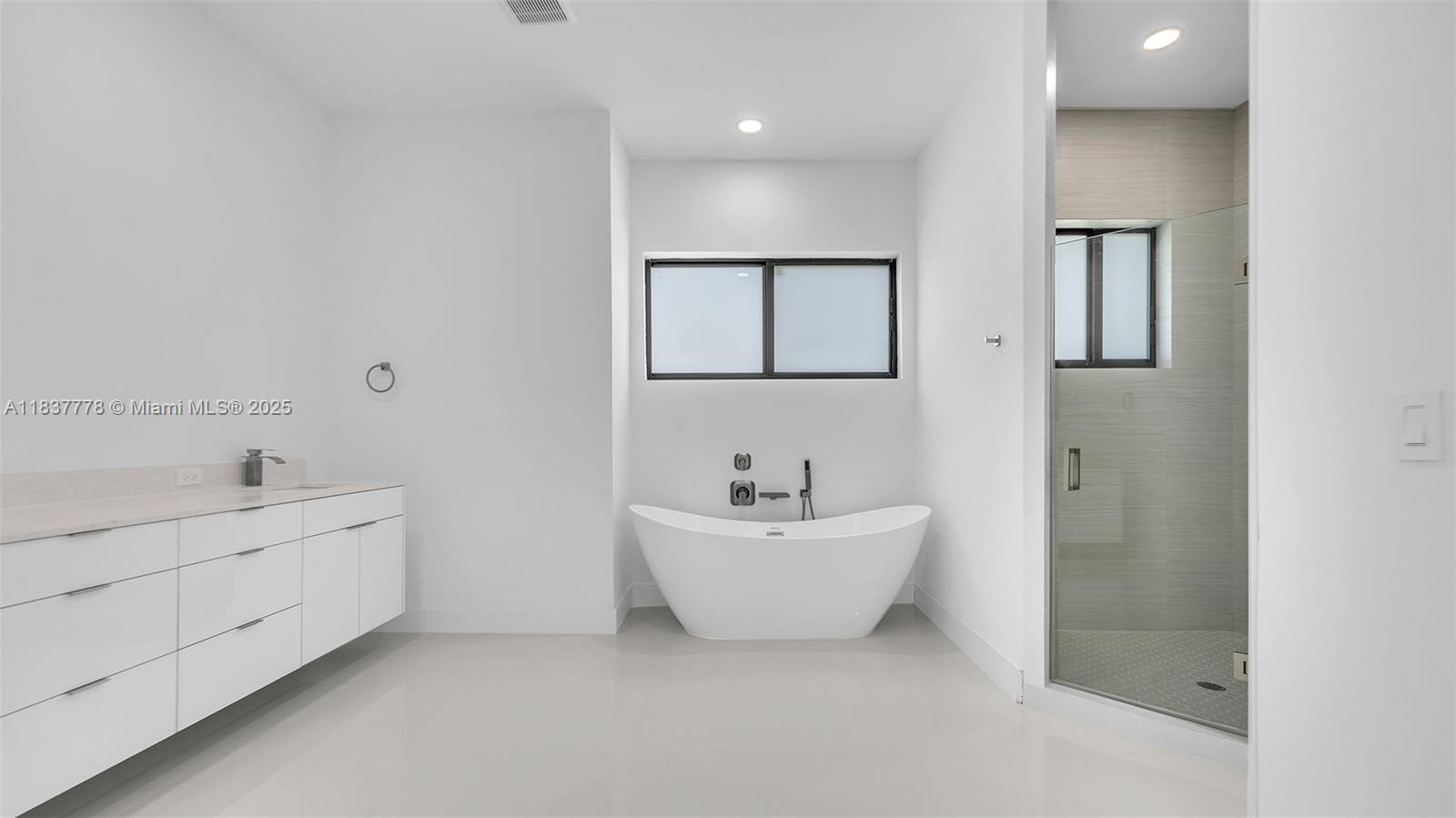 23120 Southwest 154th Court Miami, FL 33170 - Photo 31 of 51 a spacious bathroom with a bathtub sink mirror and toilet