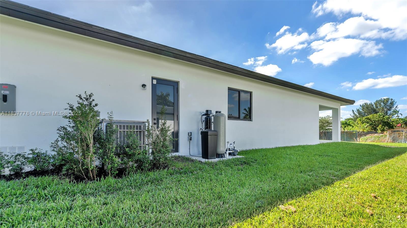 23120 Southwest 154th Court Miami, FL 33170 - Photo 41 of 51 a front view of a house with garden