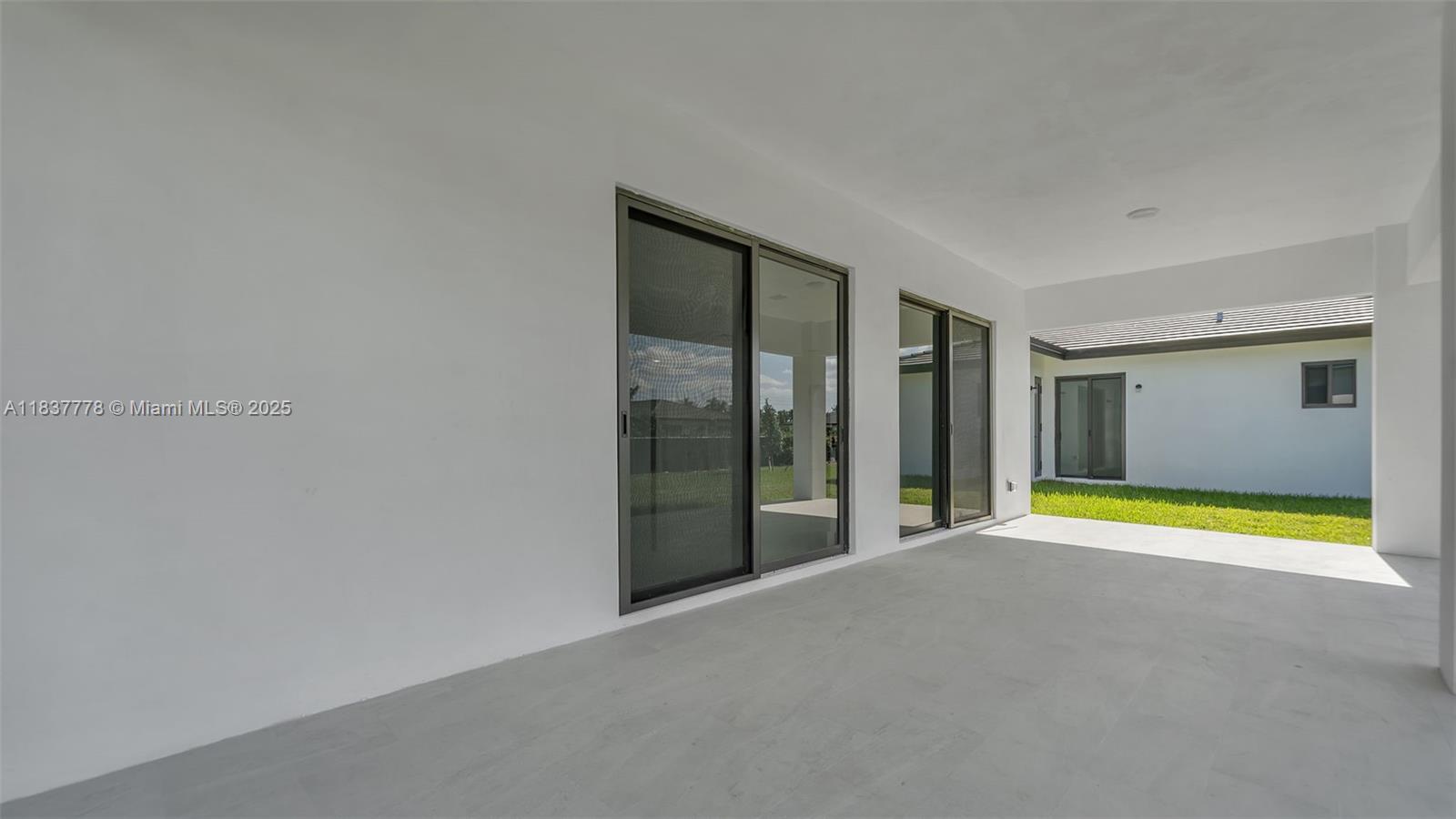 23120 Southwest 154th Court Miami, FL 33170 - Photo 42 of 51 a view of an empty room with glass door