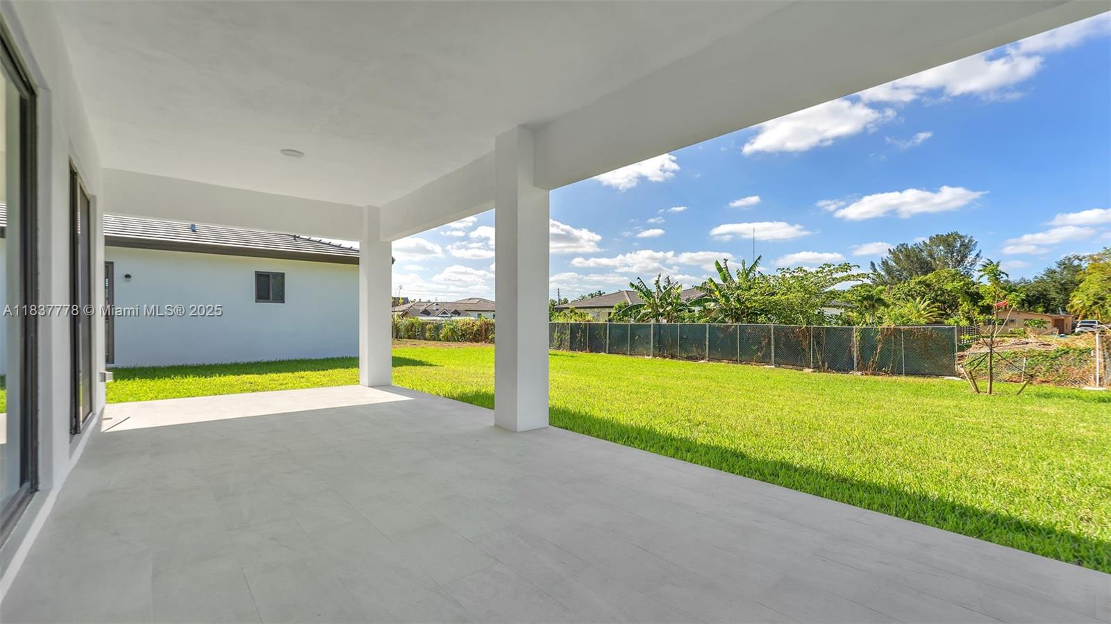 23120 Southwest 154th Court Miami, FL 33170 - Photo 43 of 51 a view of an empty room with a swimming pool