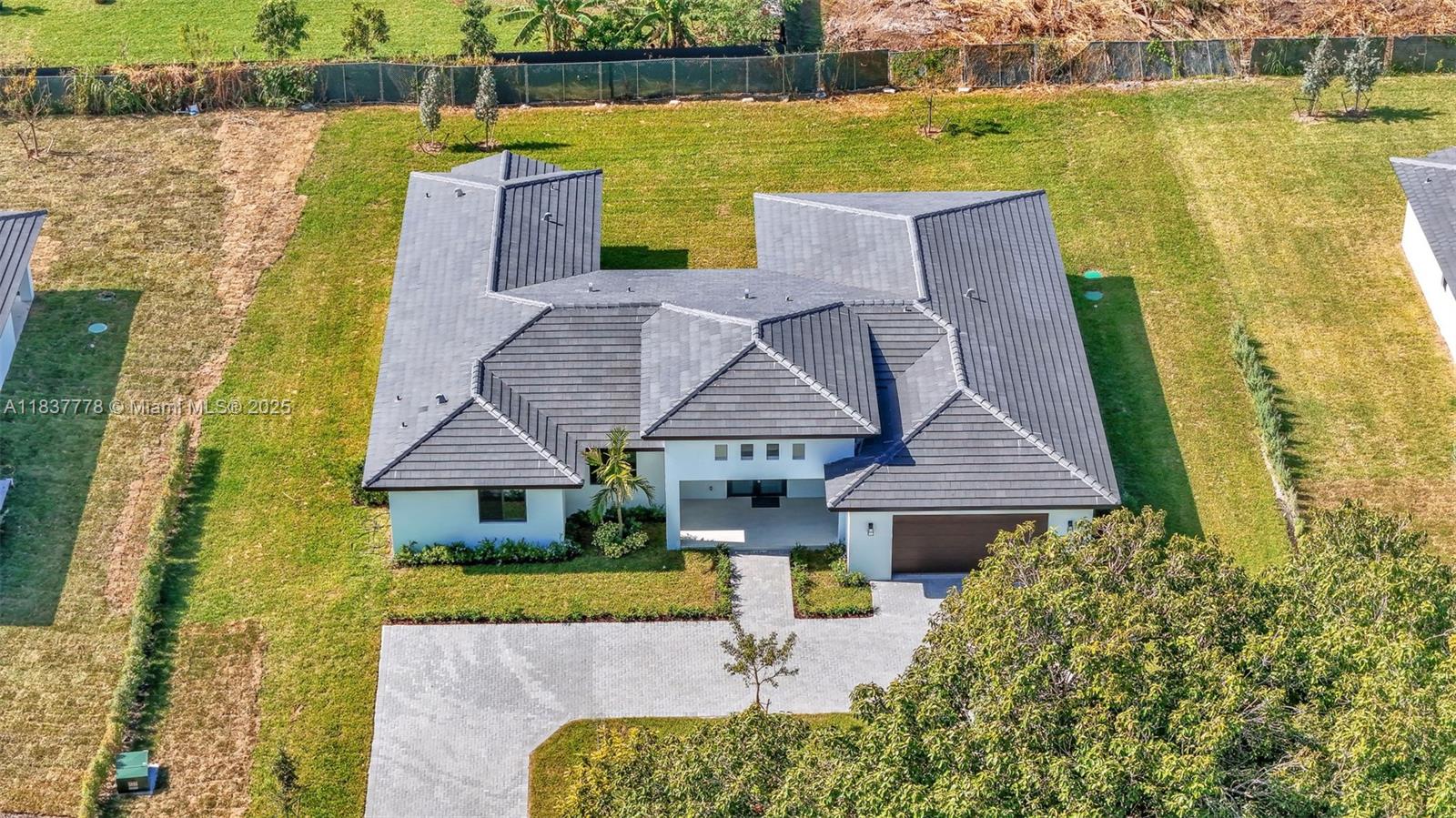 23120 Southwest 154th Court Miami, FL 33170 - Photo 49 of 51 a aerial view of a house with a ocean view