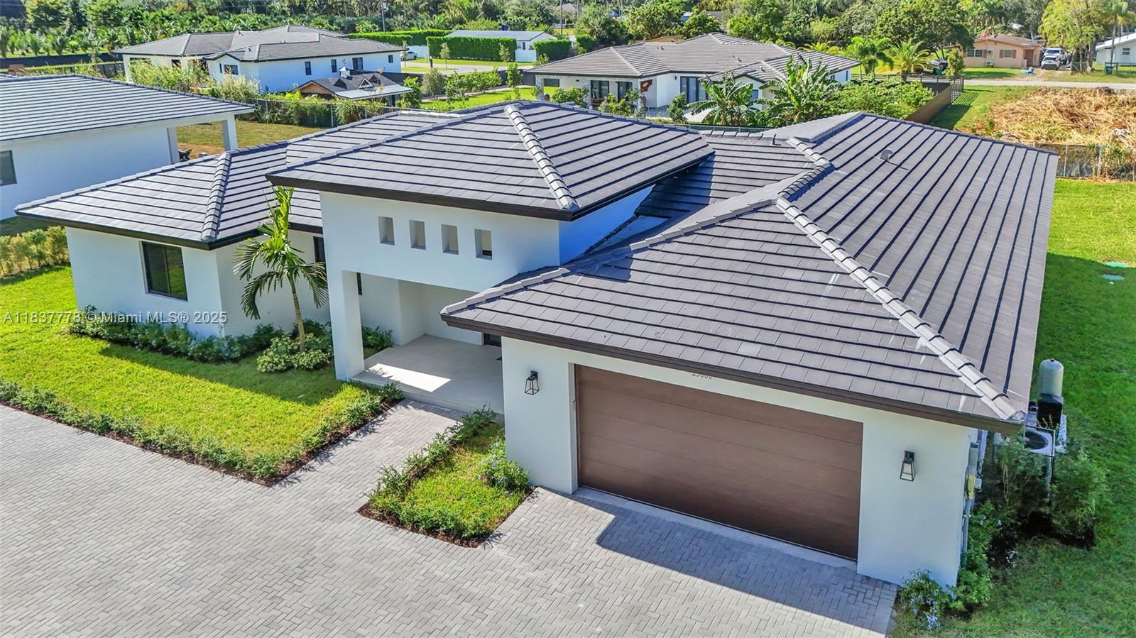 23120 Southwest 154th Court Miami, FL 33170 - Photo 51 of 51 a front view of a house with garden