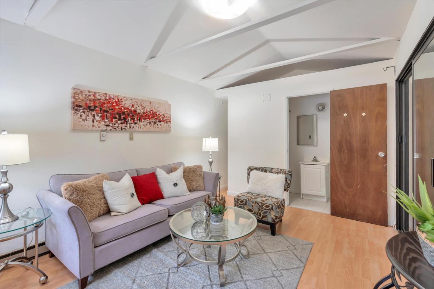 1904 Blake Street Berkeley, CA 94704 - Photo 18 of 24 a living room with furniture and a wooden floor