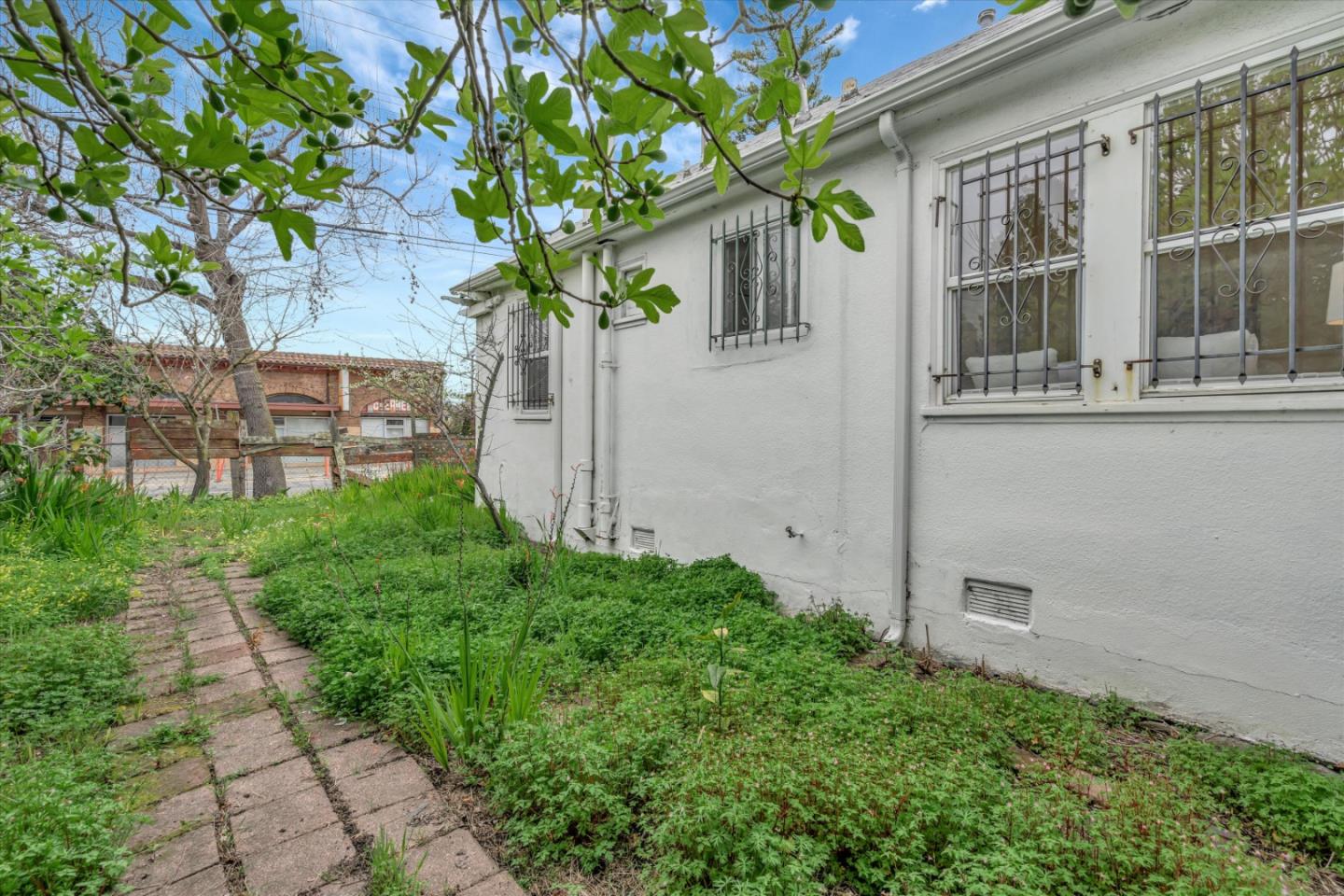 1904 Blake Street Berkeley, CA 94704 - Photo 23 of 24 a front view of a house with a garden