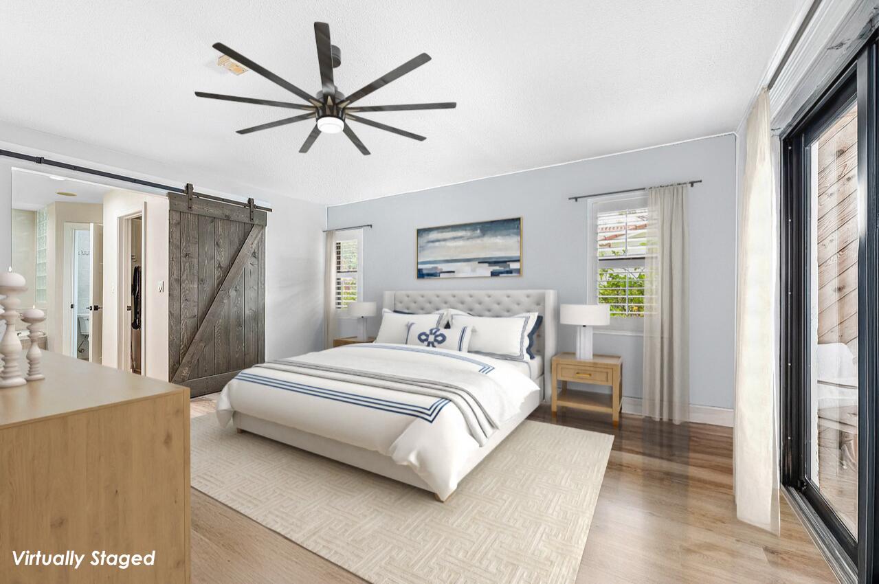 2425 Northwest 36th Street Boca Raton, FL 33431 - Photo 13 of 31 a bedroom with a bed and window