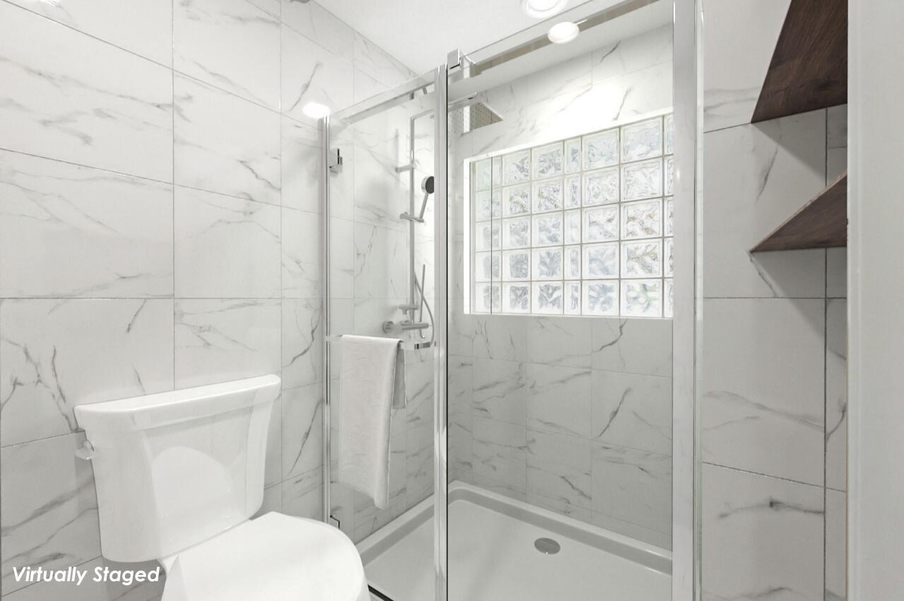 2425 Northwest 36th Street Boca Raton, FL 33431 - Photo 17 of 31 a bathroom with a toilet and shower