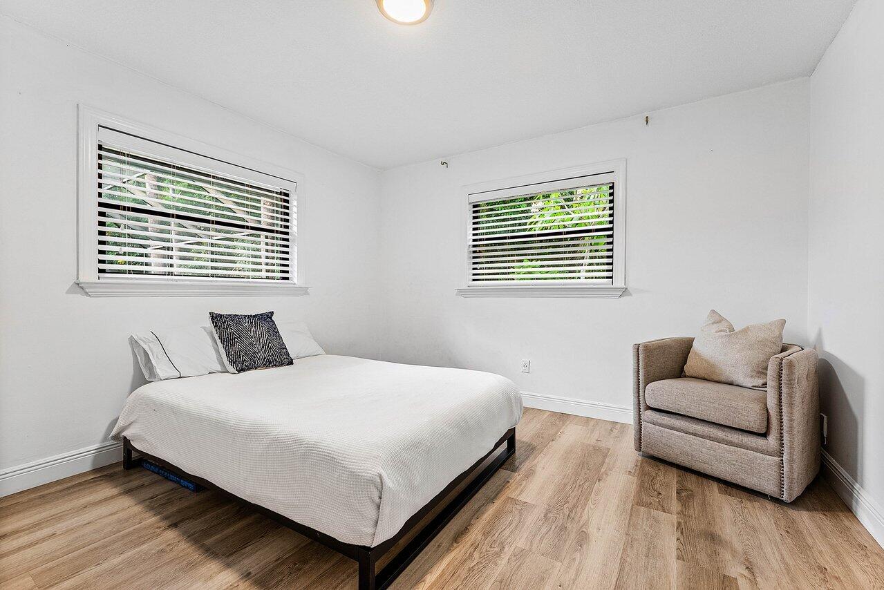 2425 Northwest 36th Street Boca Raton, FL 33431 - Photo 18 of 31 a bedroom with a bed and a couch