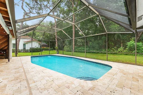 a view of a swimming pool with a lounge chairs