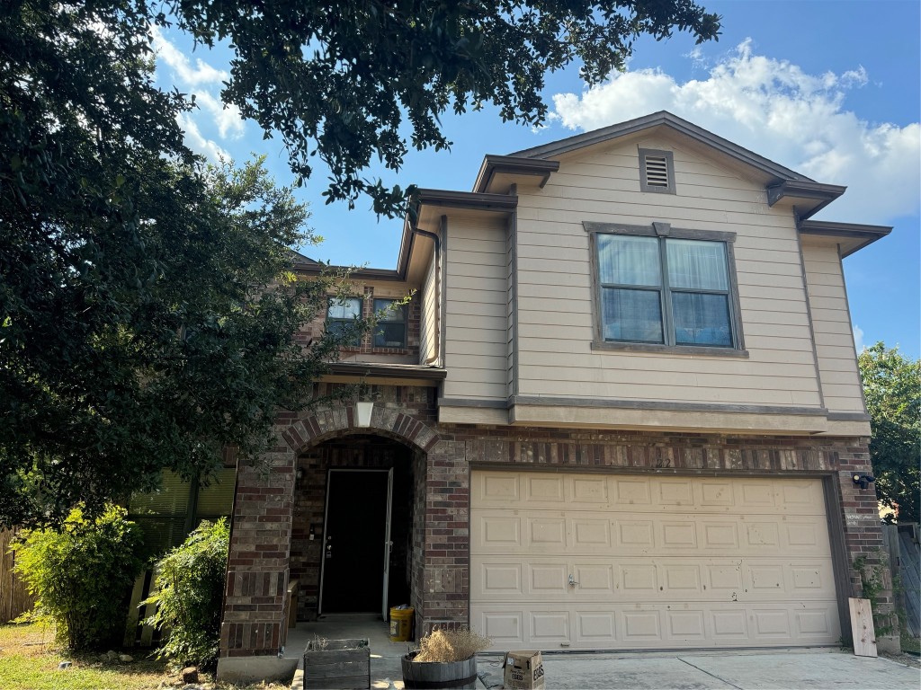 122 Ruidoso Road Kyle, TX 78640 - Photo 1 of 1 a front view of a house with plants