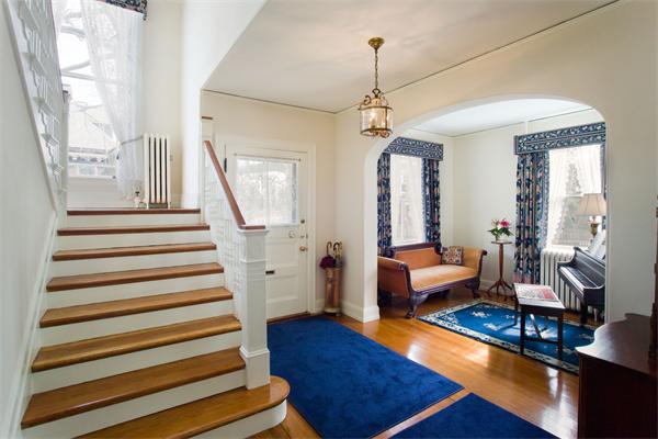 51 Upland Road Brookline, MA 02445 - Photo 2 of 14 a living room with furniture and a chandelier