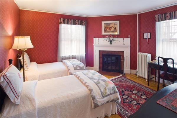 51 Upland Road Brookline, MA 02445 - Photo 8 of 14 a bedroom with a bed and a fireplace