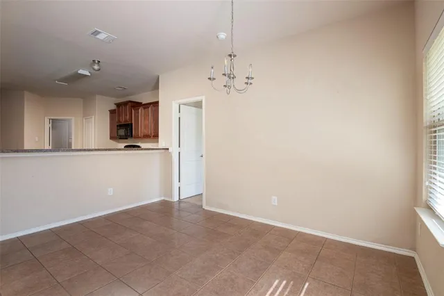 a view of a kitchen with a sink and a window