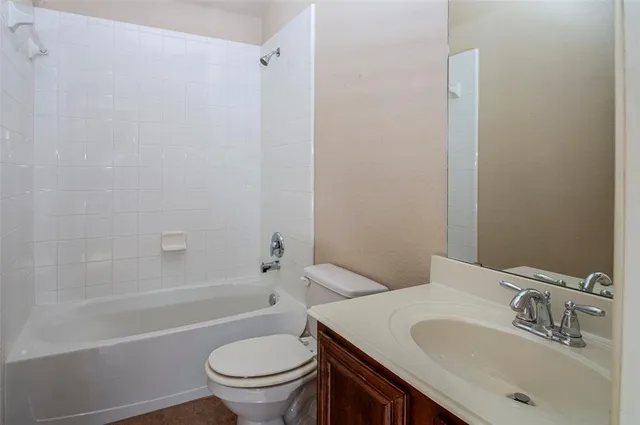 a bathroom with a sink a toilet and a bathtub