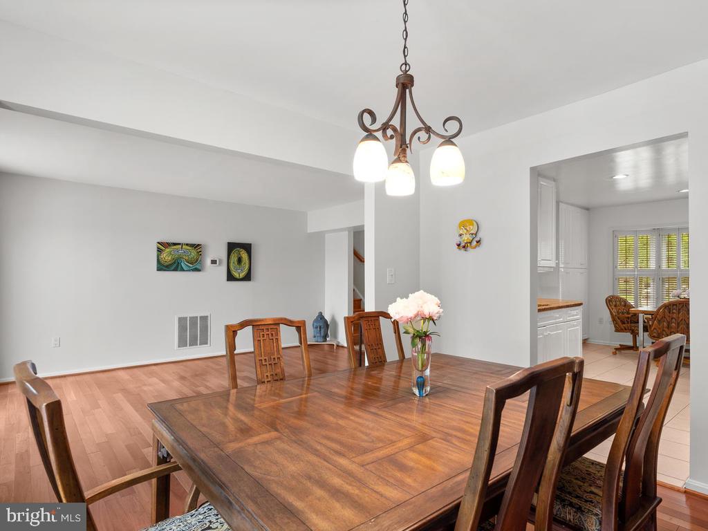 600 Bryants Nursery Road Silver Spring, MD 20905 - Photo 16 of 60 a view of a dining room with furniture and wooden floor