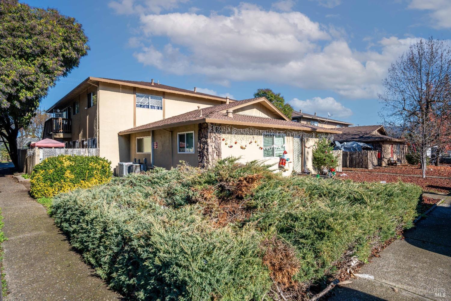 front view of a house with a garden