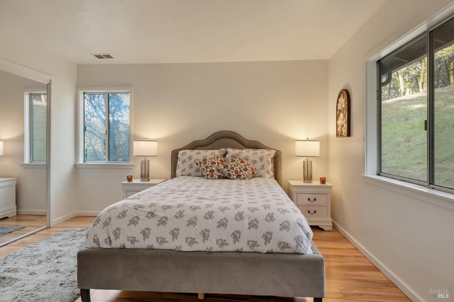 3100 Mill Creek Road Healdsburg, CA 95448 - Photo 17 of 41 a bedroom with a bed a window and potted plant