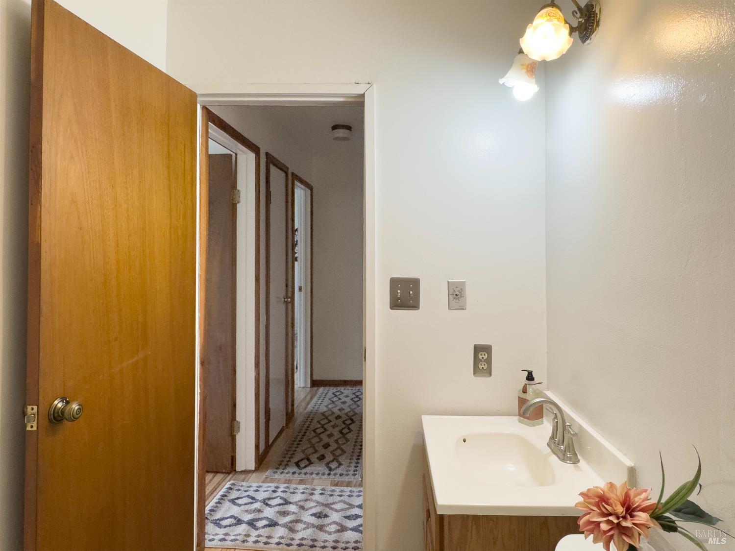 3100 Mill Creek Road Healdsburg, CA 95448 - Photo 24 of 41 a bathroom with a sink and a mirror
