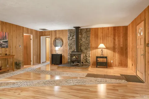a view of a livingroom with furniture and an empty room