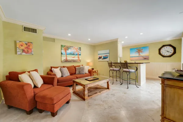 a spacious bedroom with a bed and furniture