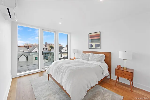 a spacious bedroom with a bed and a table