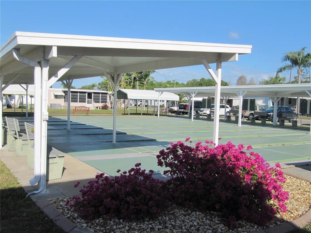 5619 Bayshore Road, Unit 115 Palmetto, FL 34221 - Photo 20 of 21 a view of a house with a yard and sitting area