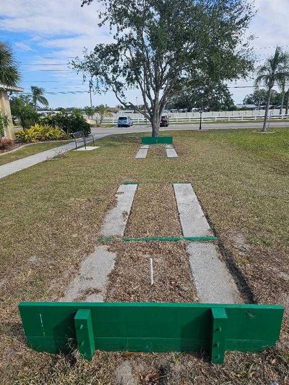5619 Bayshore Road, Unit 115 Palmetto, FL 34221 - Photo 21 of 21 a view of a yard with a bench