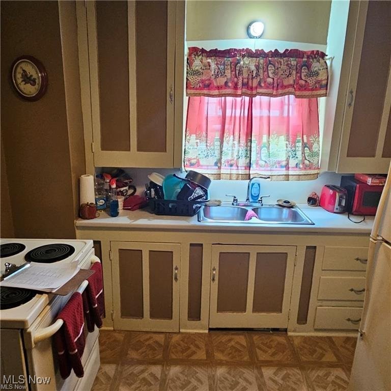 3114 Neosho Road Youngstown, OH 44511 - Photo 21 of 25 1st floor Kitchen with light countertops and white appliances