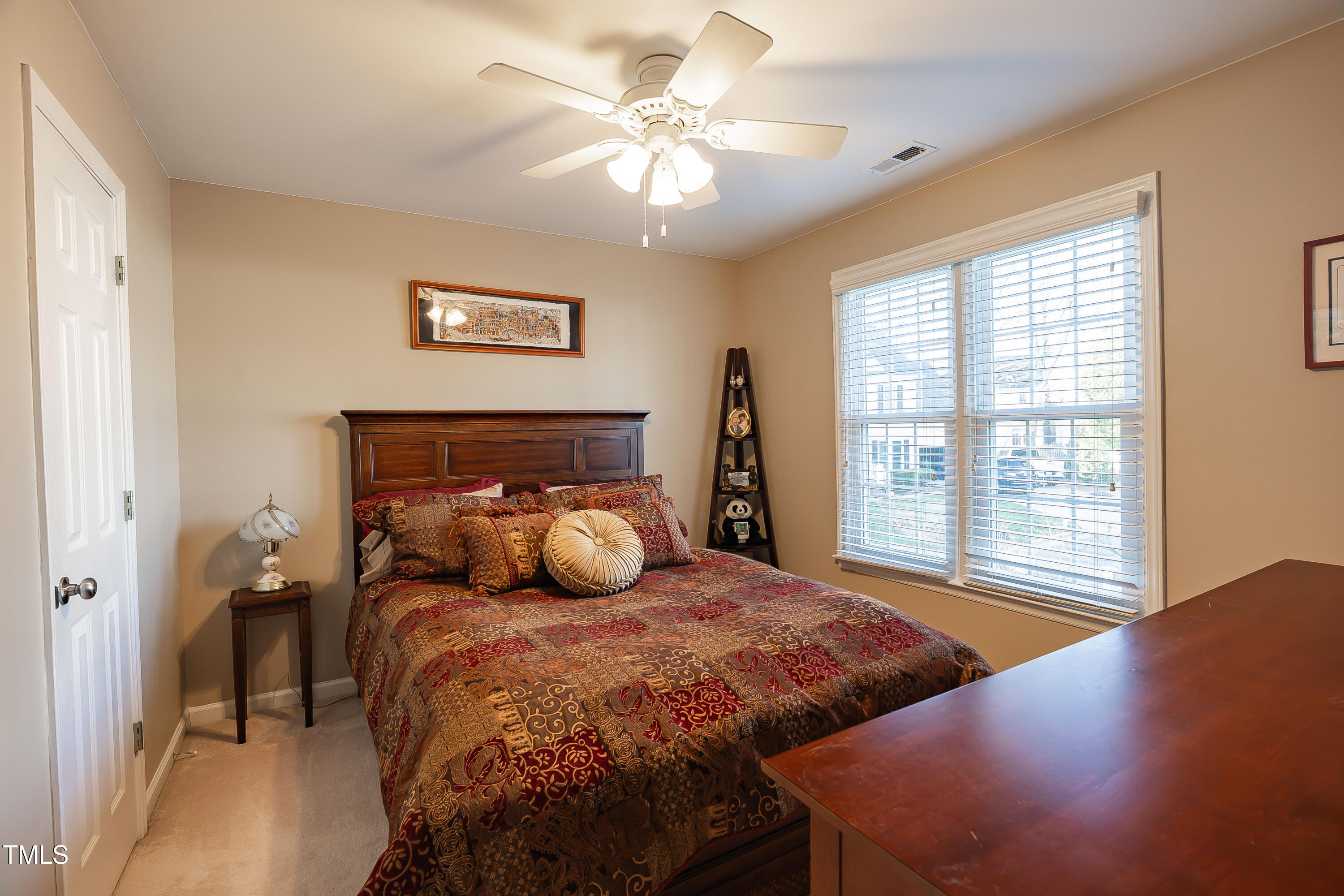 3100 Benton Circle Raleigh, NC 27615 - Photo 17 of 25 a bedroom with a bed and a chandelier
