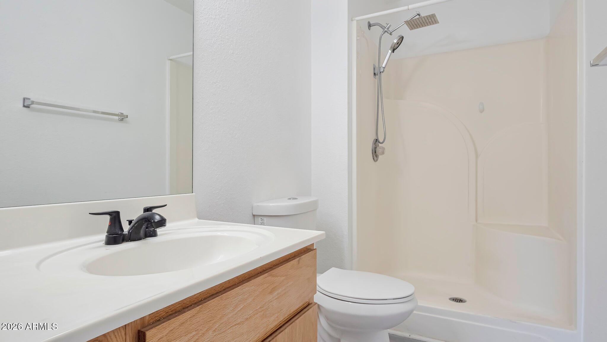 4125 North Pima Way Rimrock, AZ 86335 - Photo 10 of 14 a bathroom with a sink toilet and shower