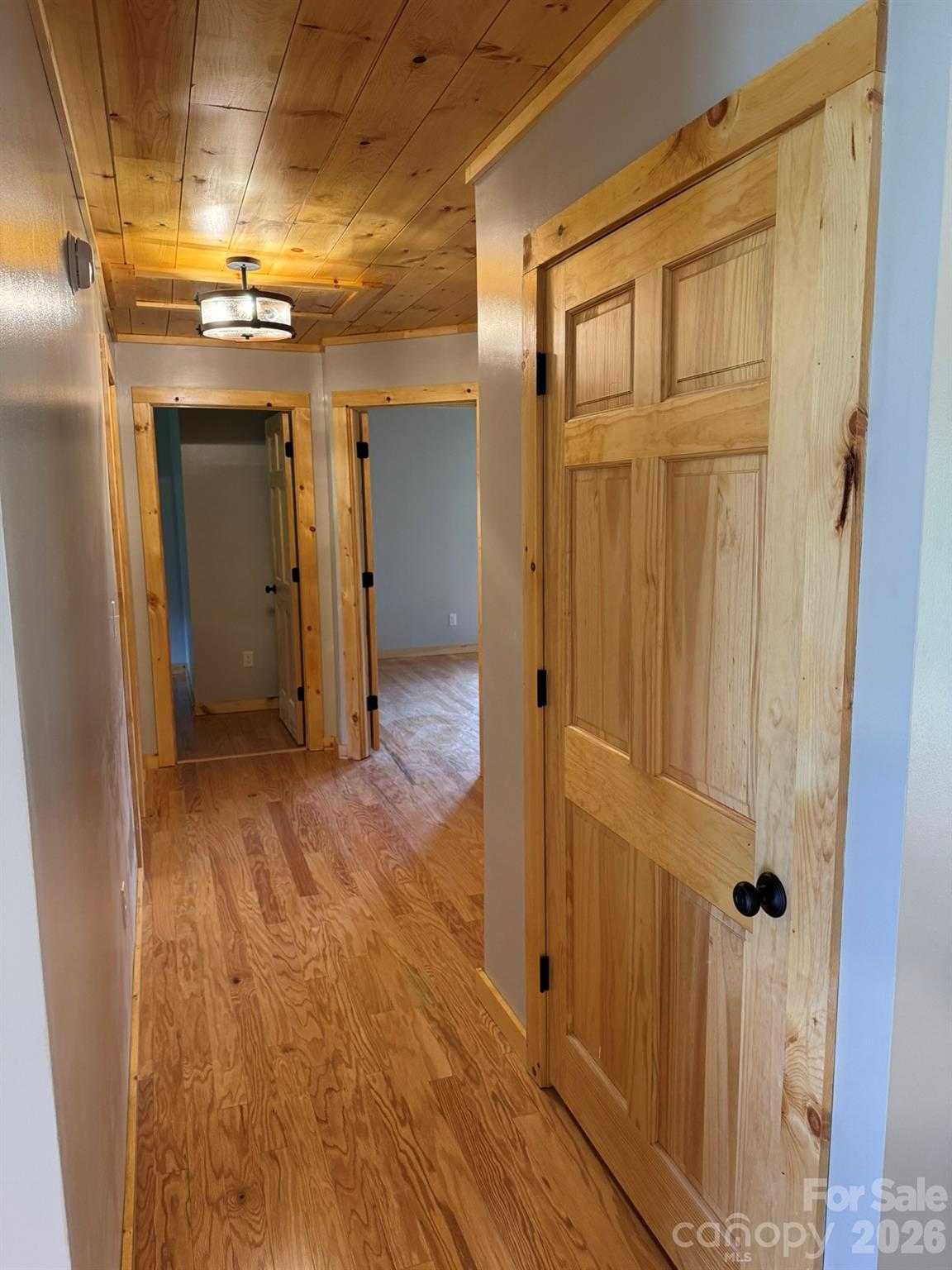 893 Carnes Road Franklin, NC 28734 - Photo 23 of 28 a view of a hallway with wooden shelves