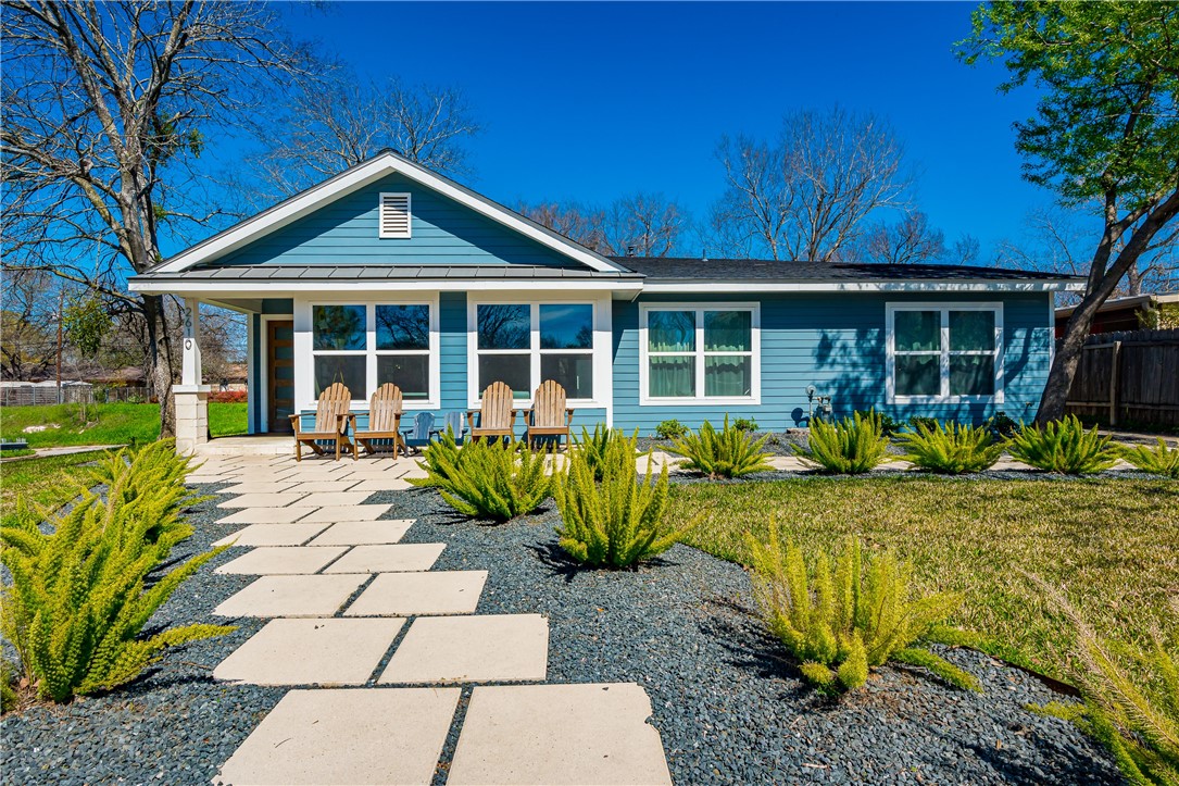 a front view of a house with garden
