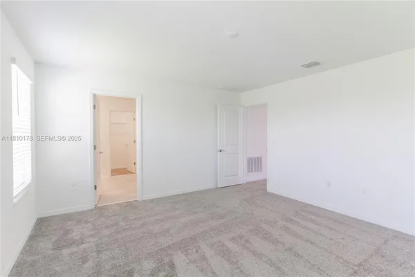 an empty room with an entryway