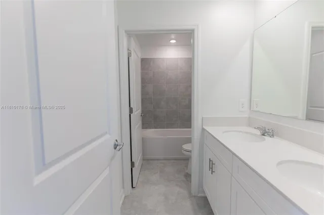 a bathroom with a bathtub and toilet