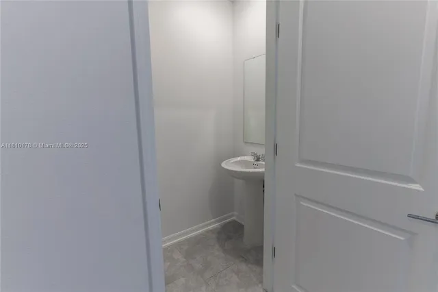 a view of bathroom and a sink