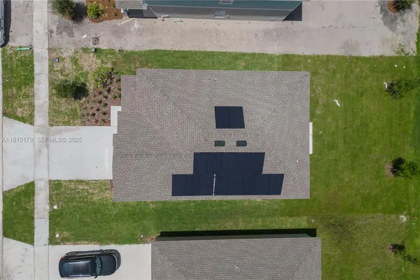 a aerial view of a house with a yard