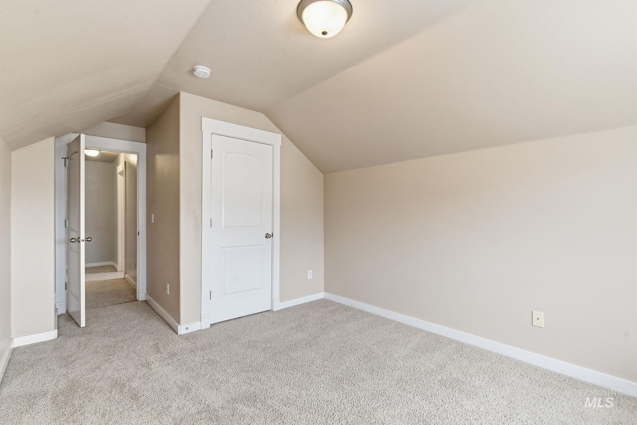 2520 Summercrest Street Caldwell, ID 83607 - Photo 21 of 42 Bonus room with light carpet and lofted ceiling