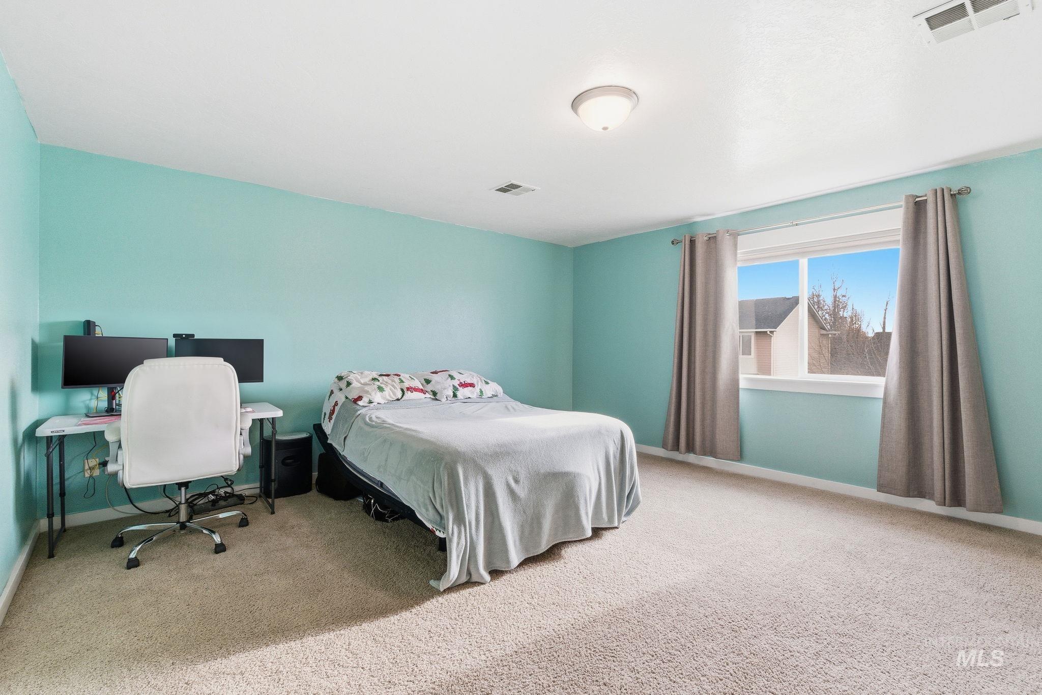 2520 Summercrest Street Caldwell, ID 83607 - Photo 26 of 42 Carpeted bedroom featuring baseboards and an office area