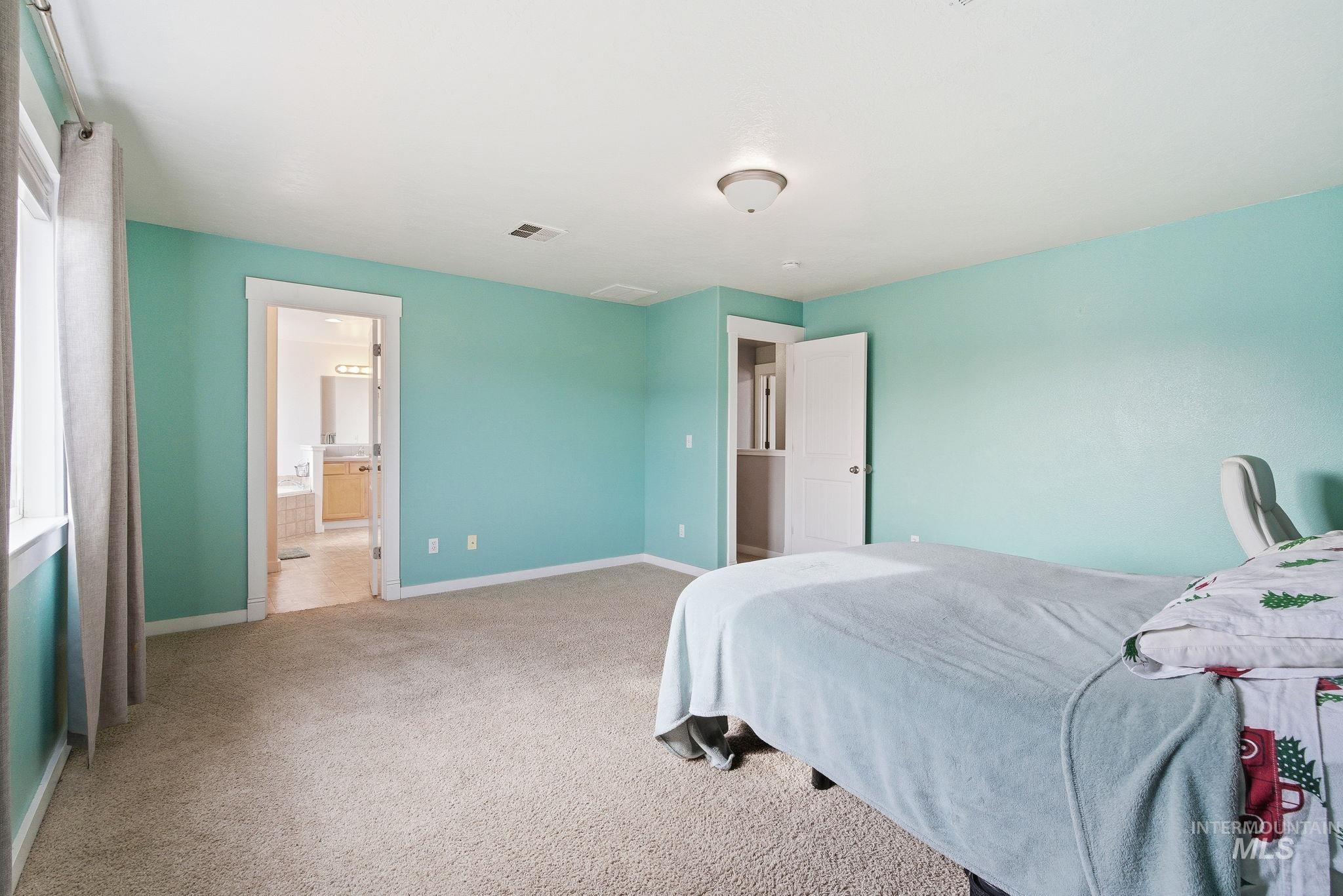 2520 Summercrest Street Caldwell, ID 83607 - Photo 27 of 42 Bedroom featuring light carpet and baseboards