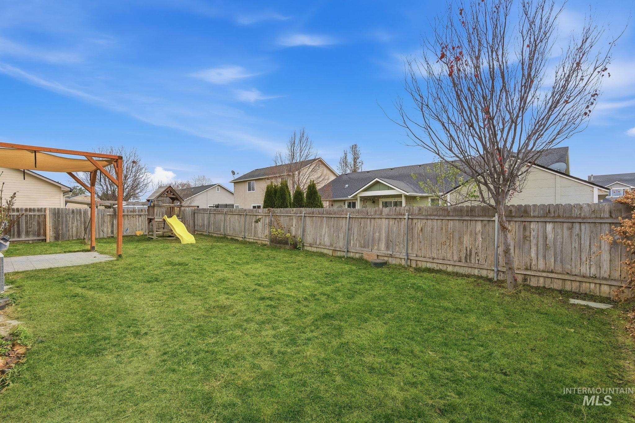 2520 Summercrest Street Caldwell, ID 83607 - Photo 39 of 42 Fenced backyard with a residential view and a playground