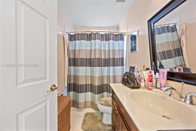 a bed room with bed and a tv