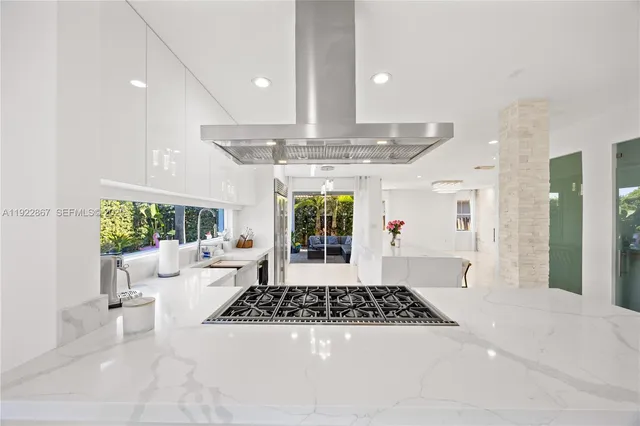 a living room with furniture and a floor to ceiling window