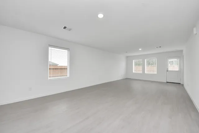 an empty room with windows