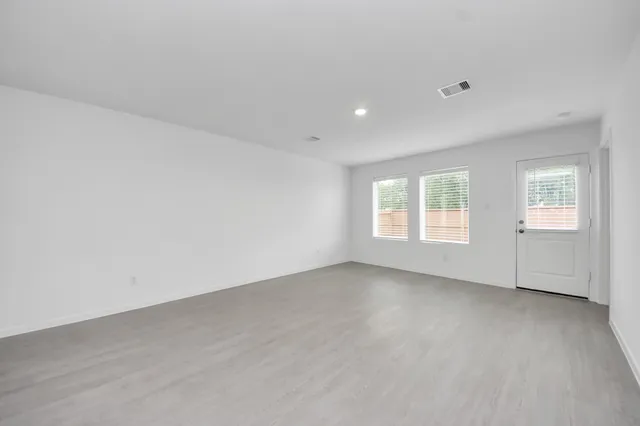 an empty room with windows