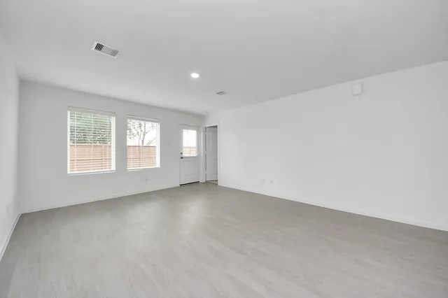 an empty room with windows