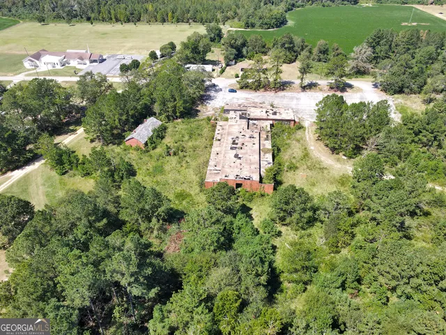 an aerial view of residential house with outdoor space and lake view