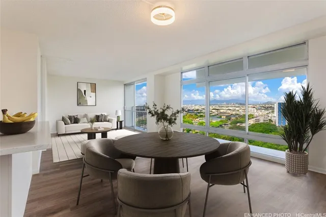 a view of a dining room with furniture window and wooden floor