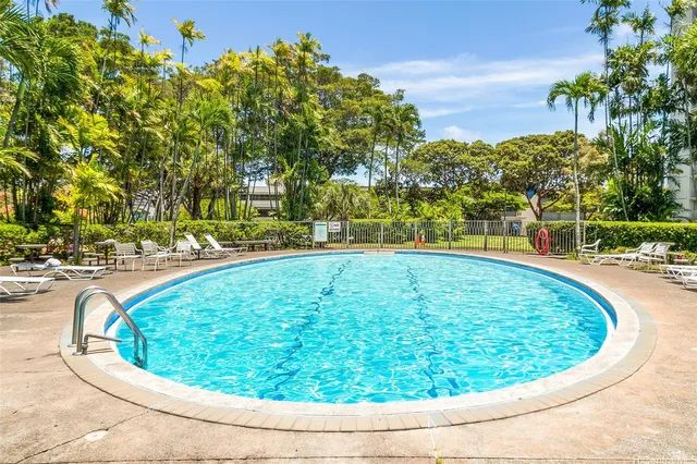 a view of swimming pool with outdoor seating